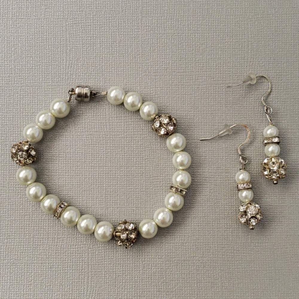 White beaded bracelet and earrings.